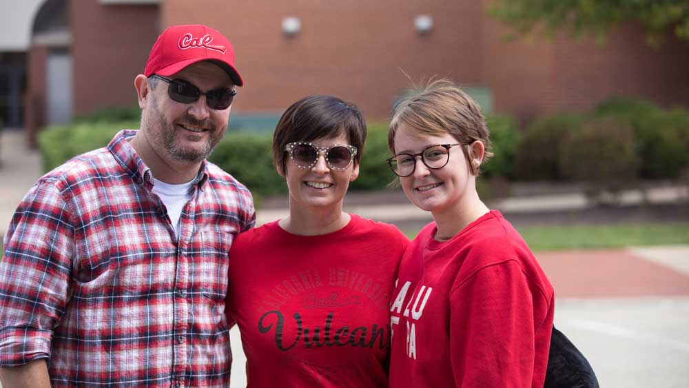 Family poses for picture at PennWest California Family Day.